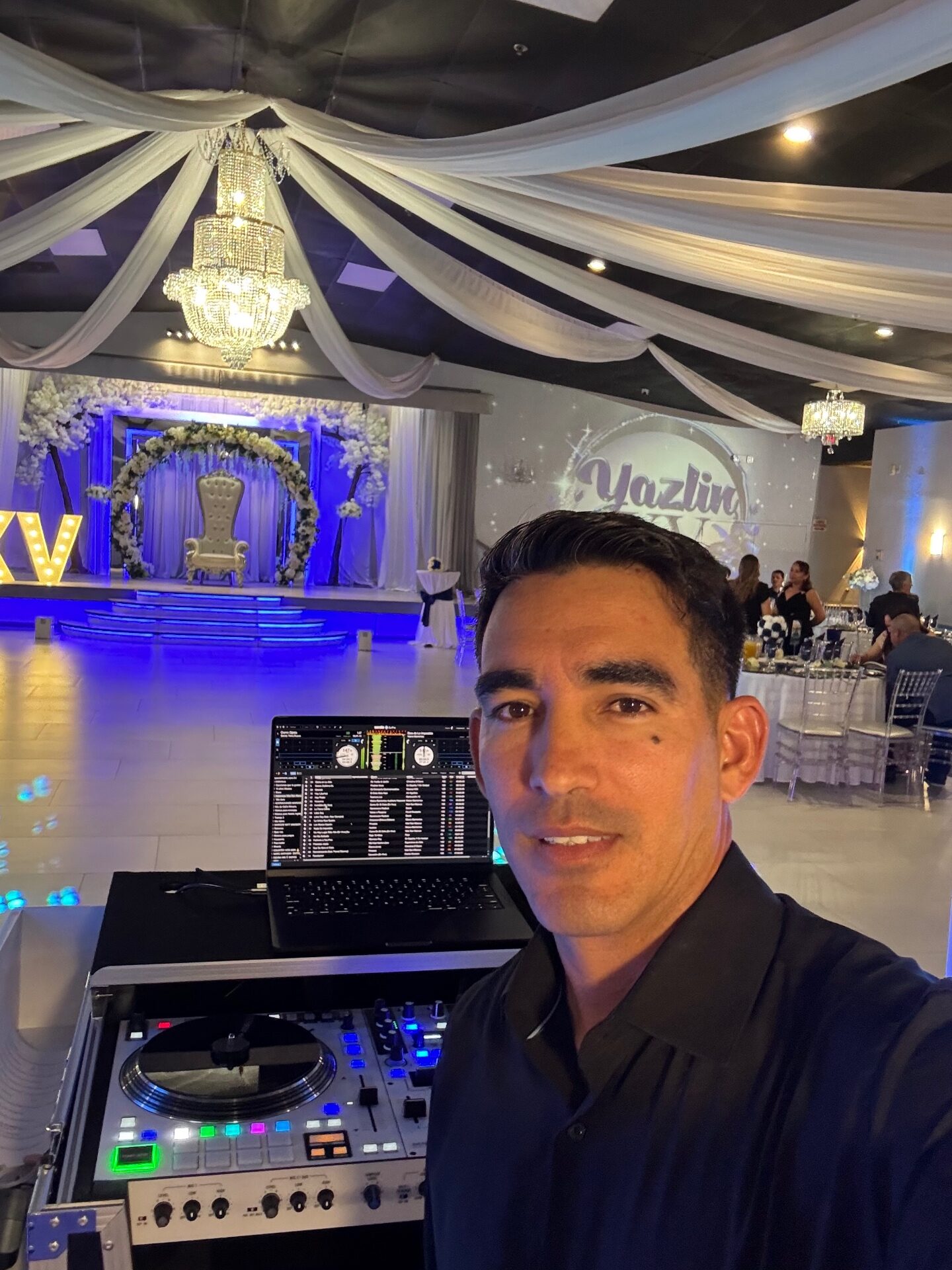 DJ Yera with team behind the booth at a Cape Coral event